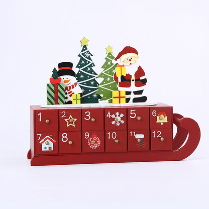 Red wooden Christmas advent calendar with Santa, snowman, trees, and gift decorations