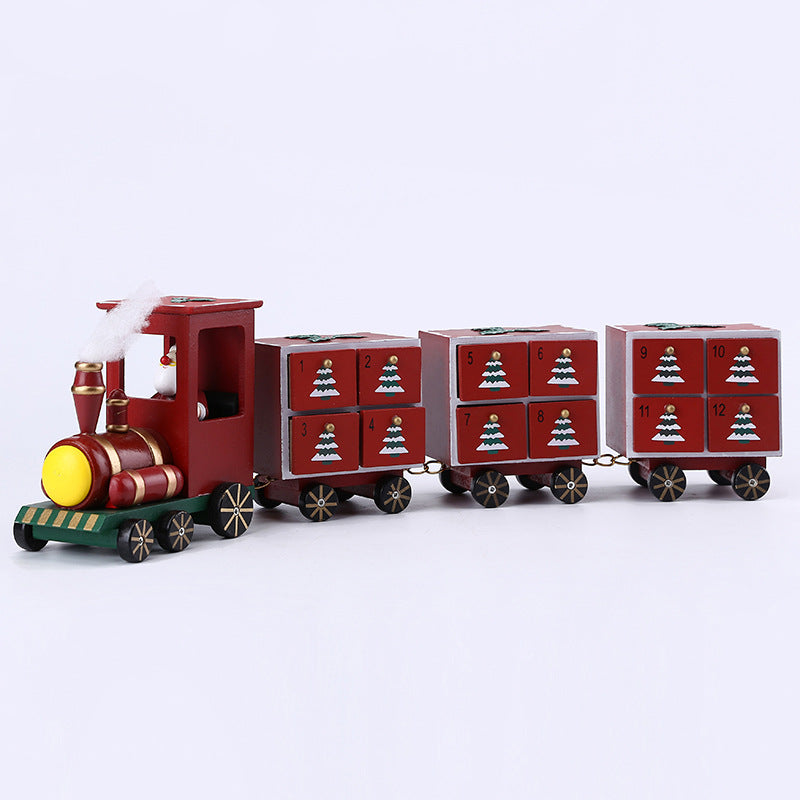 Handmade wooden Christmas train with numbered red drawers and festive tree designs holiday decor