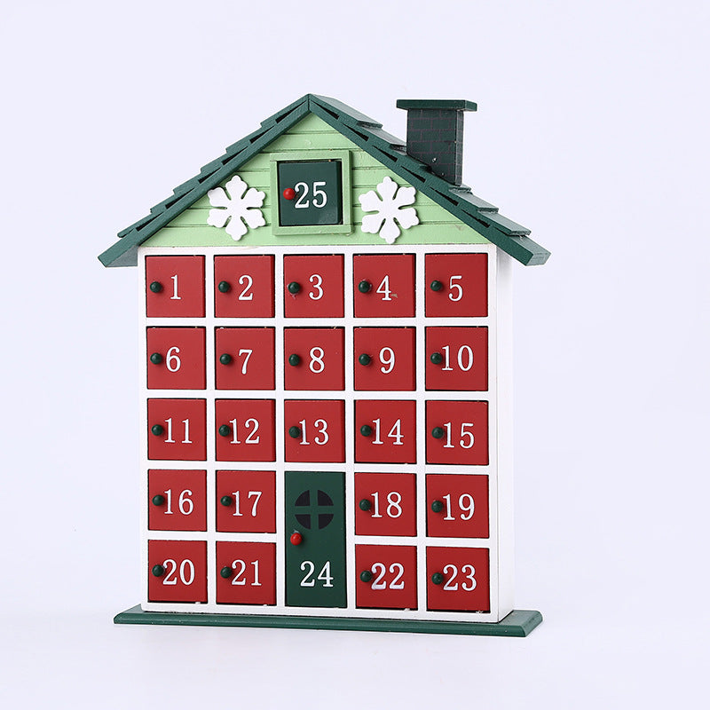 Wooden Christmas countdown calendar shaped like a house with numbered red doors and green roof