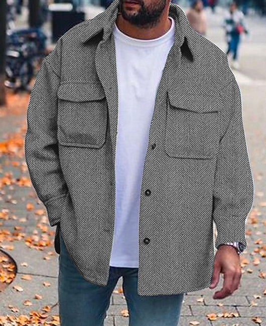 man wearing grey herringbone men's polo collar coat with long sleeves on autumn street