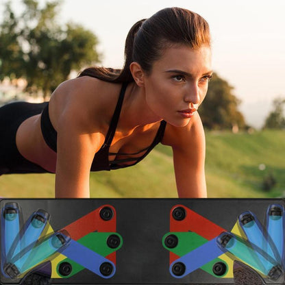 Woman doing push-ups outdoors using colorful folding push-up board for home gym workout
