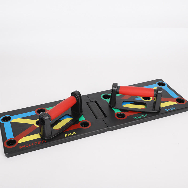 Foldable push-up board with red handles and color-coded spots for shoulders, back, triceps, and chest exercises