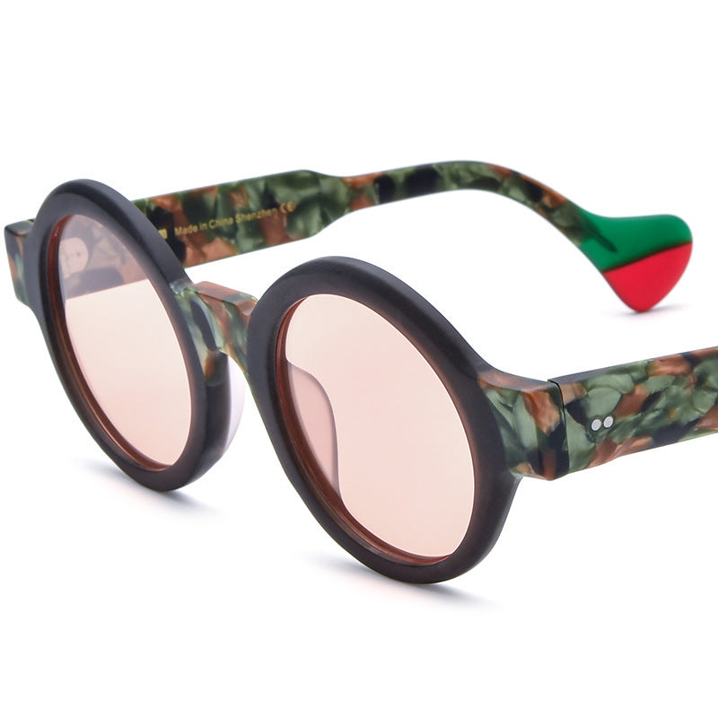 Round frosted green and brown camo sunglasses with pink lenses and red-green temple tips