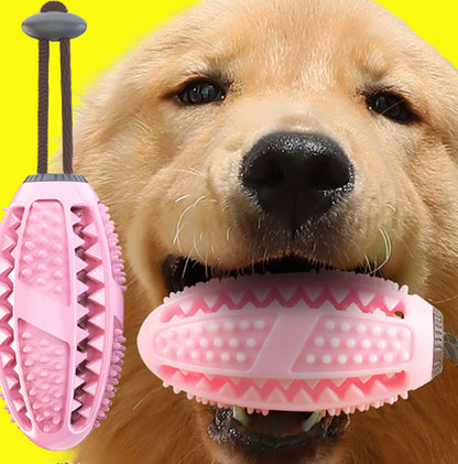 Golden retriever dog holding pink interactive chew ball toy with suction cup for dental cleaning and tug play