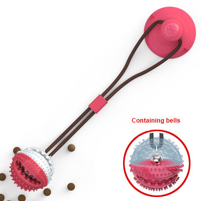 Interactive dog ball toy with suction cup, chewable spiked surface, and internal bells