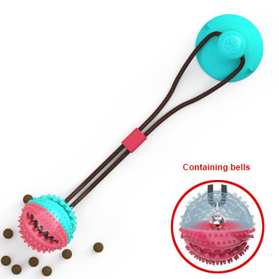 Interactive dog ball toy with suction cup and chewable textured surface containing bells for dental cleaning and tug play