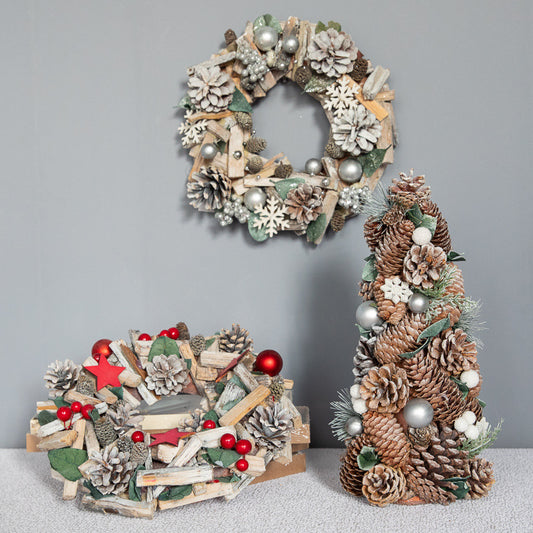 Rustic Christmas wreaths with pinecones, silver balls, red berries, wooden stars, and snowflake decorations