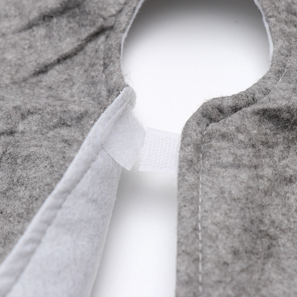 Close-up of gray felt Christmas tree skirt with Velcro closure on white background