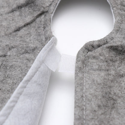 Close-up of gray felt Christmas tree skirt with Velcro closure on white background