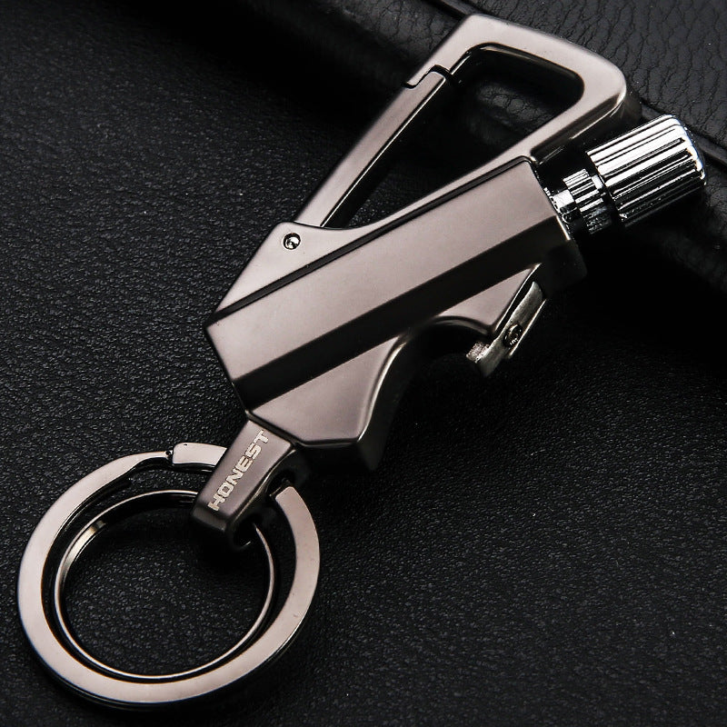 sleek metallic keychain lighter with carabiner clip and keyring on black textured surface