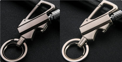 close-up of gold metal keychain lighter with bottle opener and flint striker on black leather surface