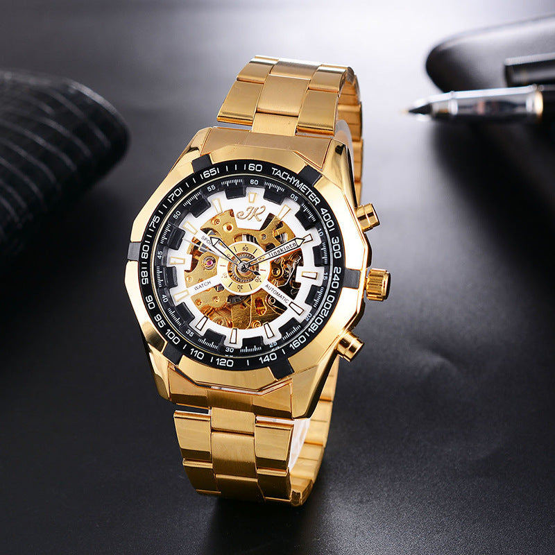 Gold men's mechanical wristwatch with automatic movement and hollow dial on black surface
