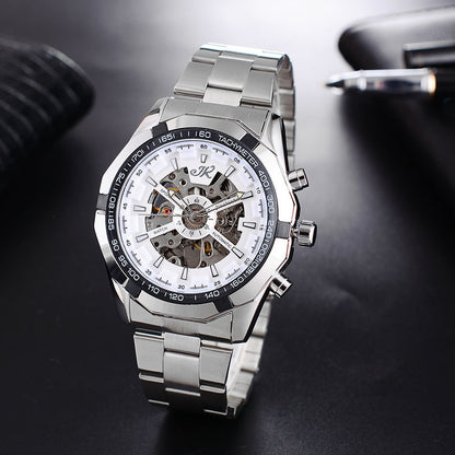 Silver men's mechanical wristwatch with skeleton dial, automatic movement, and tachymeter bezel on black surface