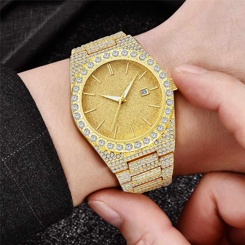 Gold men's wristwatch with diamond-studded strap and bezel, gold textured dial, and calendar date display