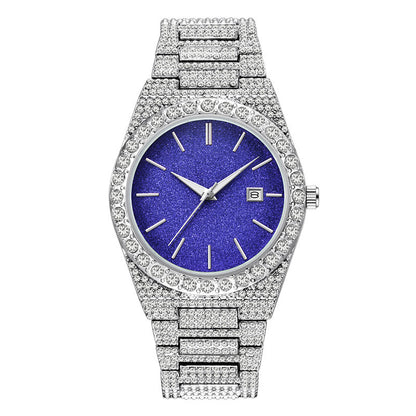 Luxury silver watch with sparkling crystal-studded band and bezel, blue glitter dial, date display