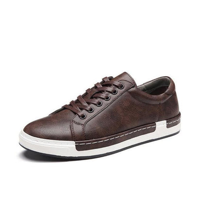 Brown leather men's casual sneaker with white rubber sole and lace-up design