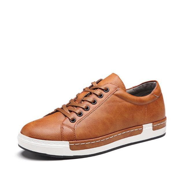 Men's brown leather sneaker with white rubber sole and black eyelets, casual shoe design