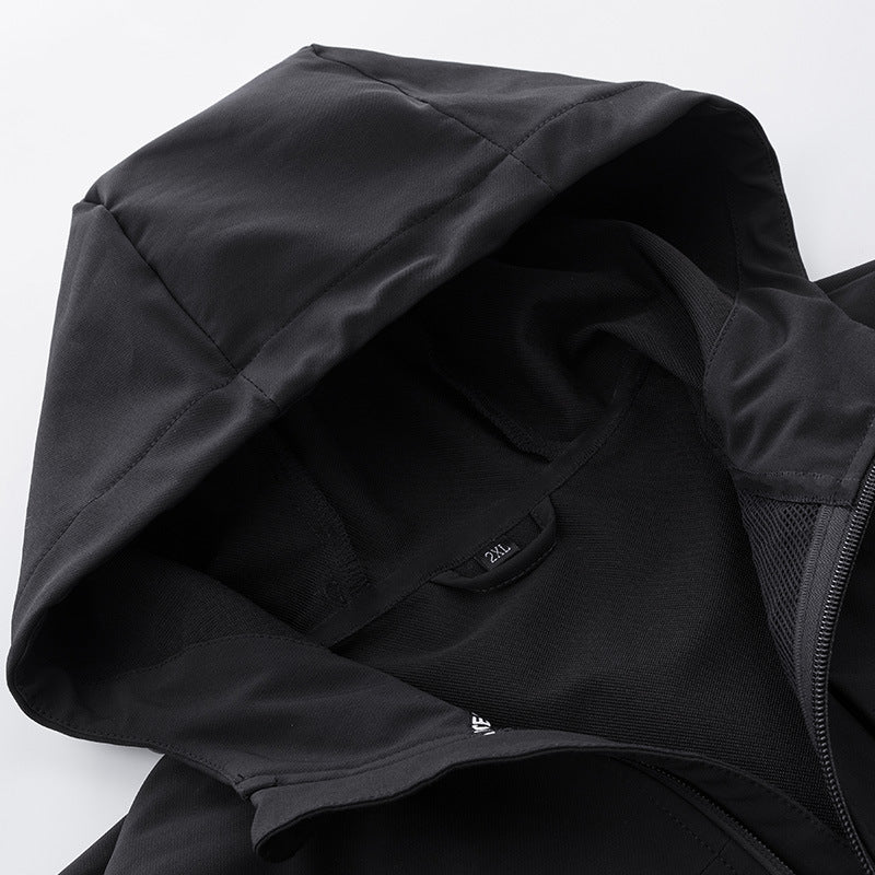 close-up of black waterproof mountaineering jacket hood and zipper with breathable fabric