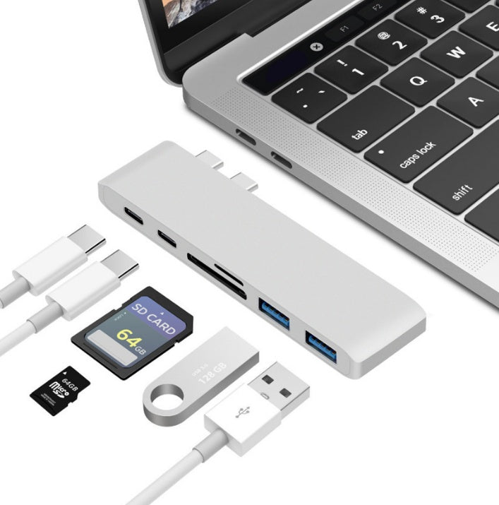 Gray Trendoligy USB-C hub with SD and TF card reader, two USB 3.0 ports, connected to a MacBook