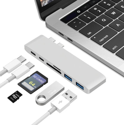Gray Trendoligy USB-C hub with SD and TF card reader, two USB 3.0 ports, connected to a MacBook