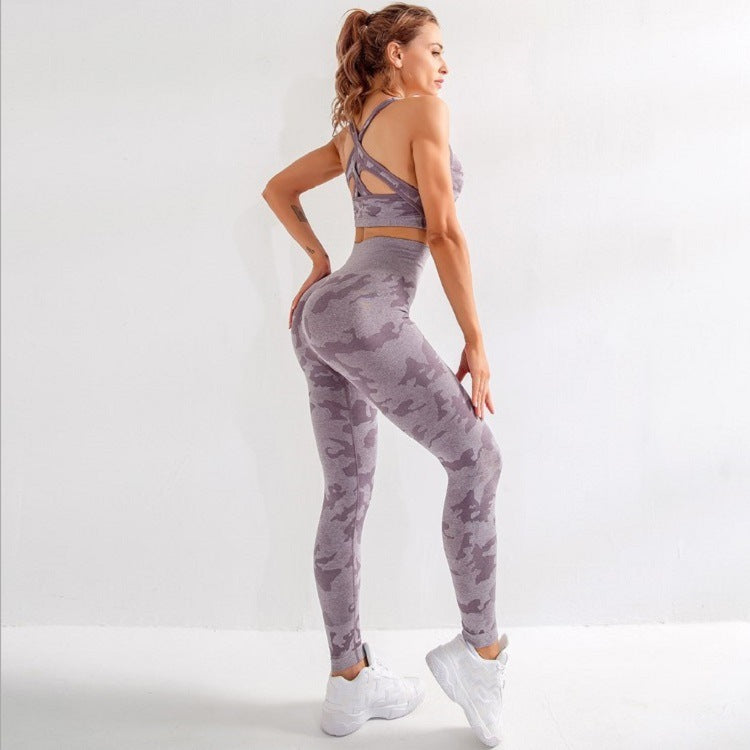 Woman in purple camo seamless high-waist leggings and sports bra with criss-cross back, white sneakers