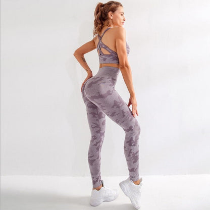 Woman in purple camo seamless high-waist leggings and sports bra with criss-cross back, white sneakers