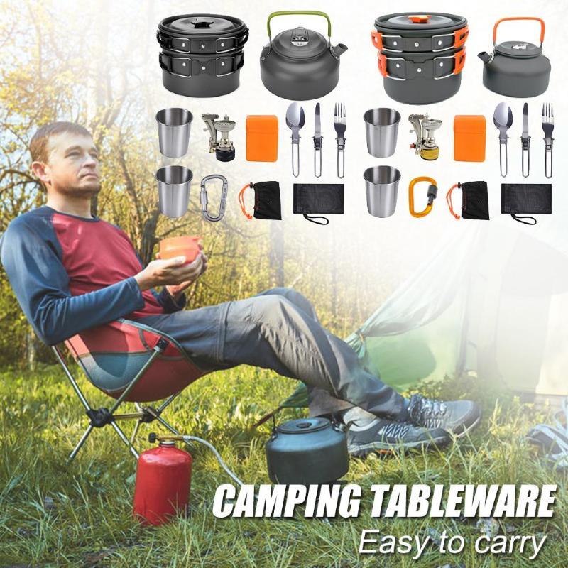 Lightweight green camping cookware set with pots, kettle, stove, utensils, and camping gear outdoors