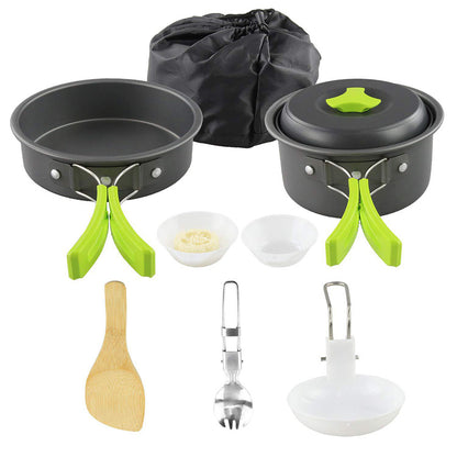 Lightweight green-handle aluminum camping cookware set with pot, pan, utensils, and carrying bag