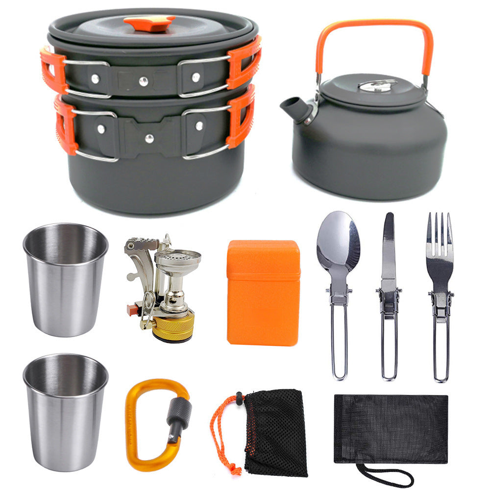 Compact black and orange lightweight camping cookware set with pots, kettle, stove, utensils, cups, carabiner, and carrying bags