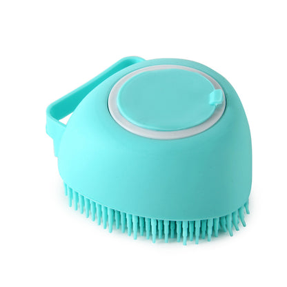 Blue round silicone dog bath brush with soft bristles and built-in shampoo dispenser