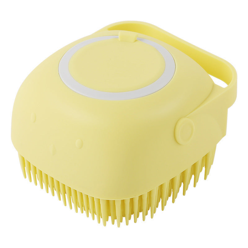 Yellow silicone pet bath brush with soft bristles and ergonomic handle for gentle grooming