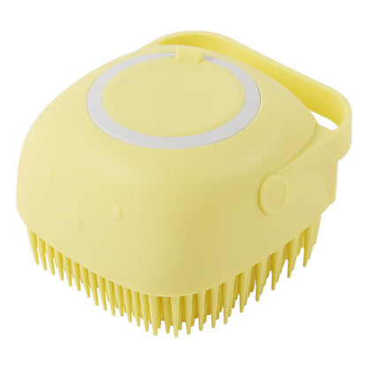 Yellow silicone pet bath brush with soft bristles and ergonomic handle for gentle grooming