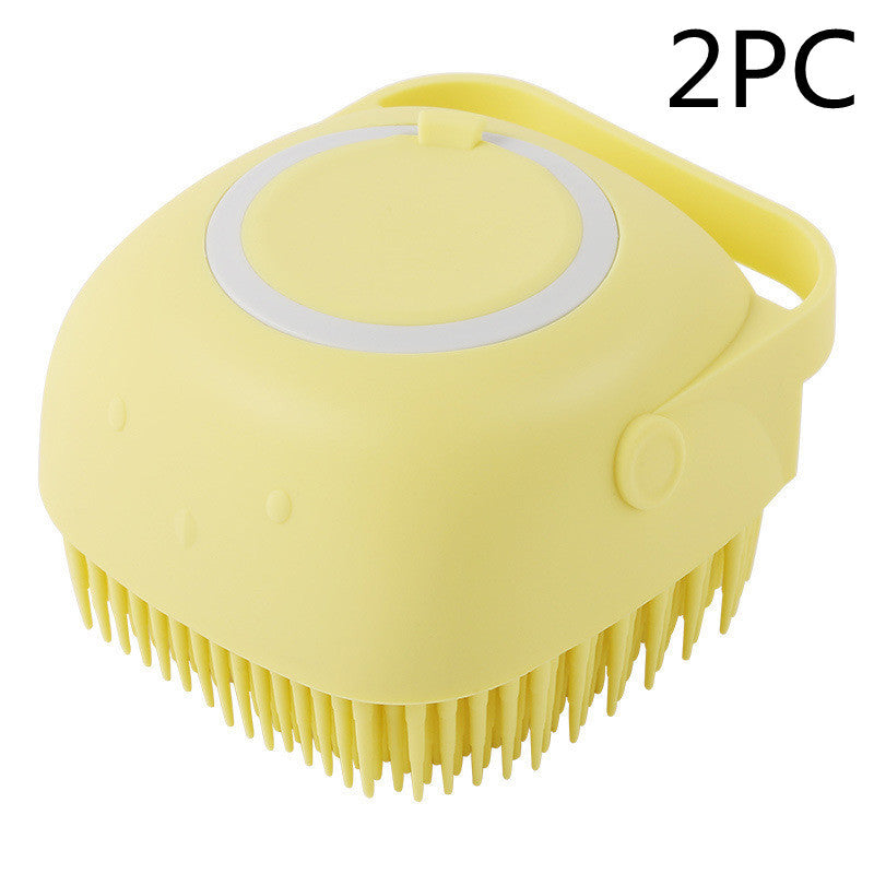 Yellow silicone pet grooming brush with soft bristles and handle for gentle fur cleaning