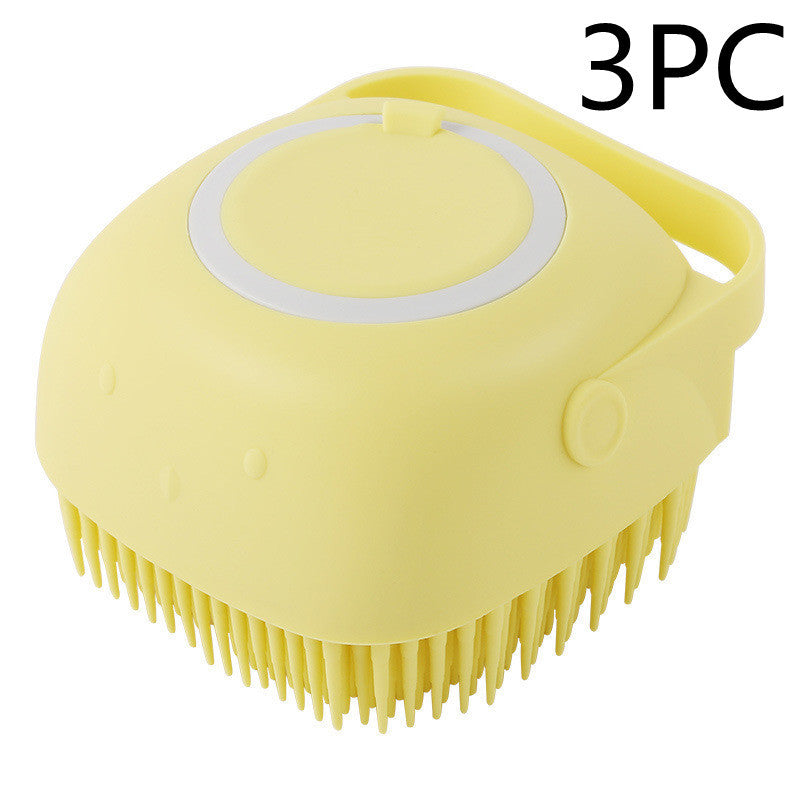 Yellow soft silicone pet grooming brush with flexible bristles and ergonomic handle