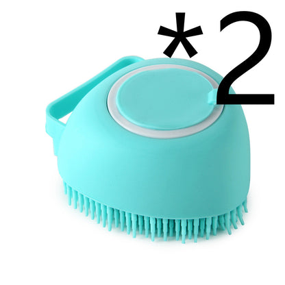 Blue silicone dog bath brush with soft bristles and shampoo dispenser handle