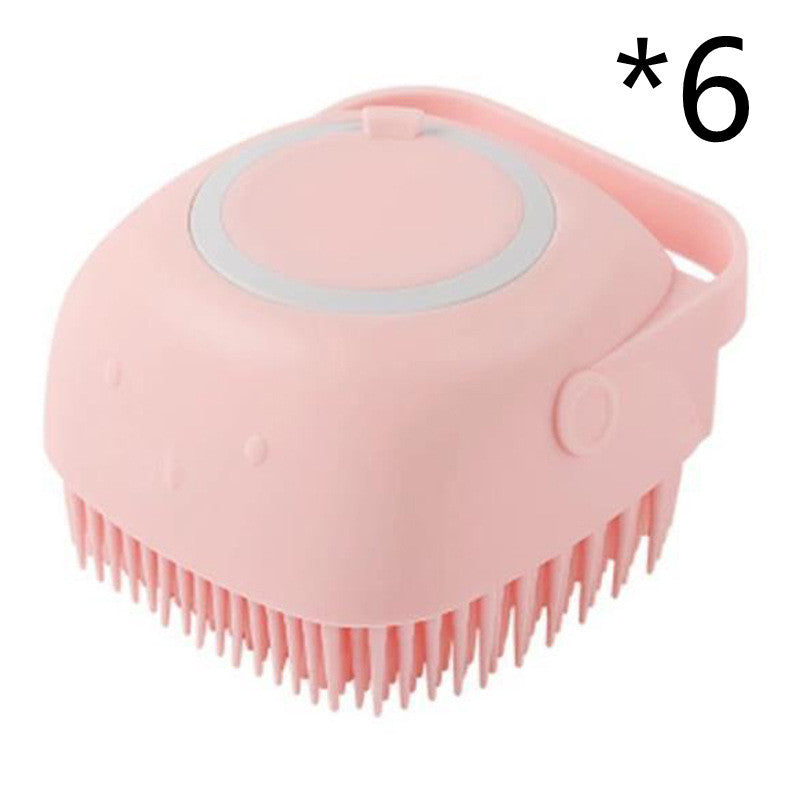 pink silicone dog bath brush with soft bristles and a handle for gentle grooming
