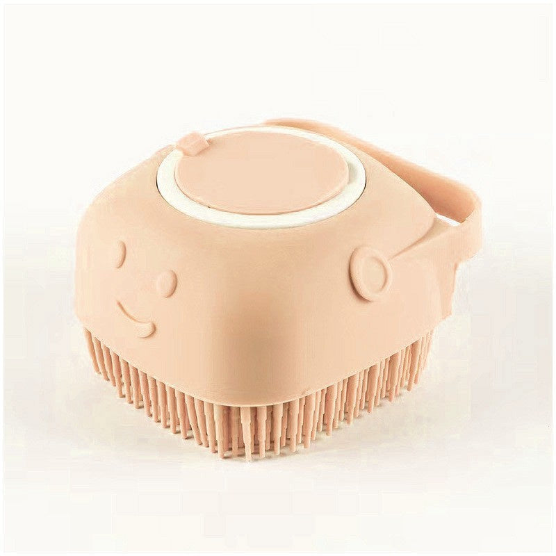 peach silicone dog grooming brush with soft bristles and shampoo dispenser, smiling face design