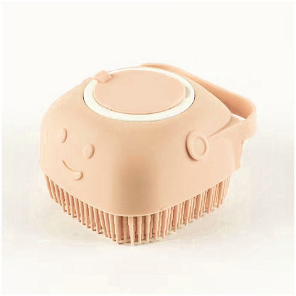 peach silicone dog grooming brush with soft bristles and shampoo dispenser, smiling face design