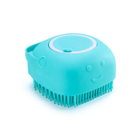 Blue silicone dog bath brush with soft bristles and smiling face design