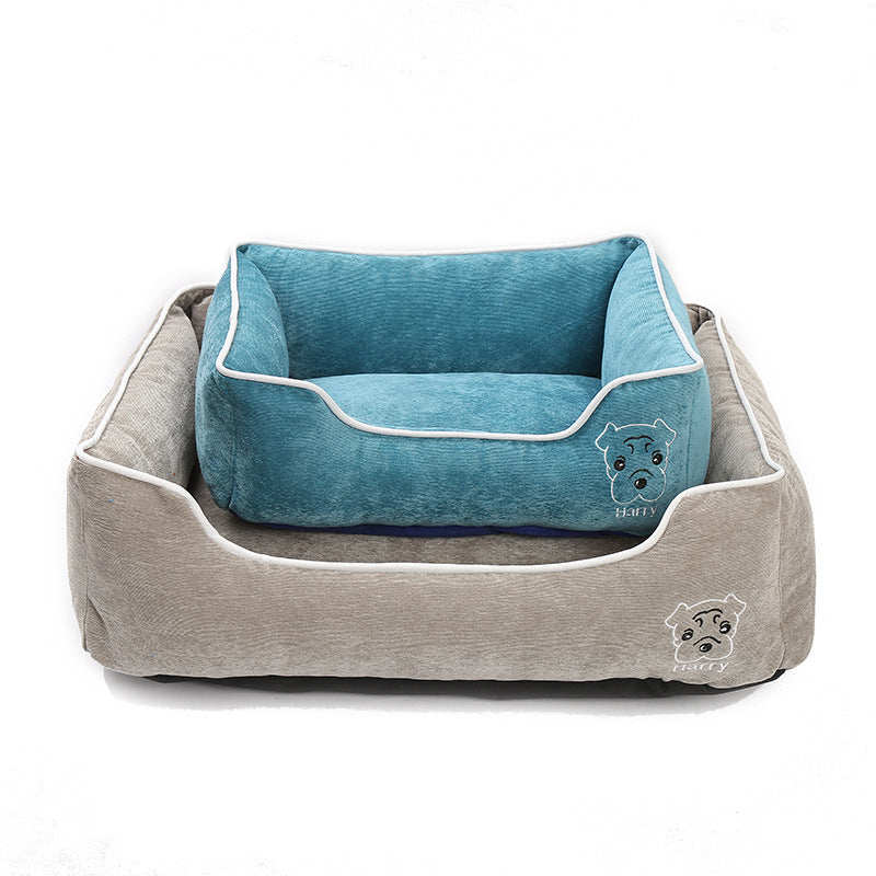 Two soft corduroy dog beds in blue and beige with white piping and dog face embroidery