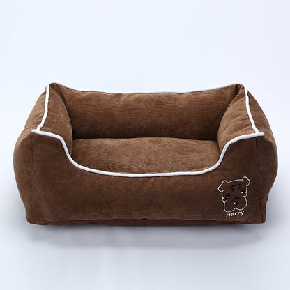 Brown corduroy dog bed with white piping and embroidered dog face labeled Harry
