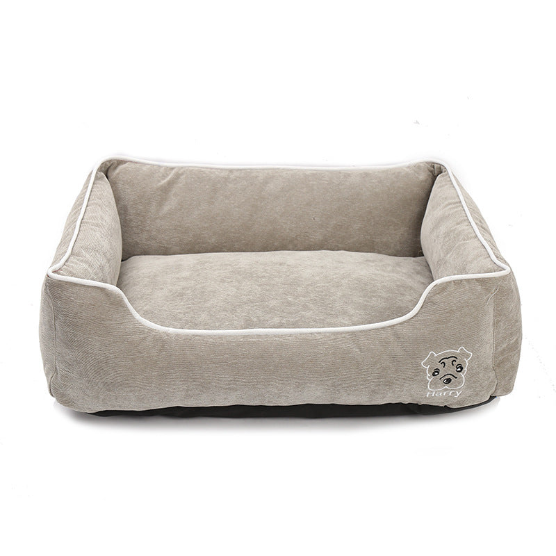 Beige soft corduroy dog bed with raised sides and dog face embroidery on white background