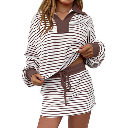 Woman wearing brown and white striped long sleeve polo top and matching drawstring skirt outfit
