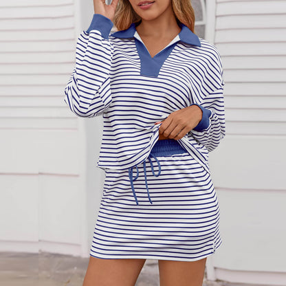 Woman wearing blue and white striped long sleeve top and matching skirt casual outfit