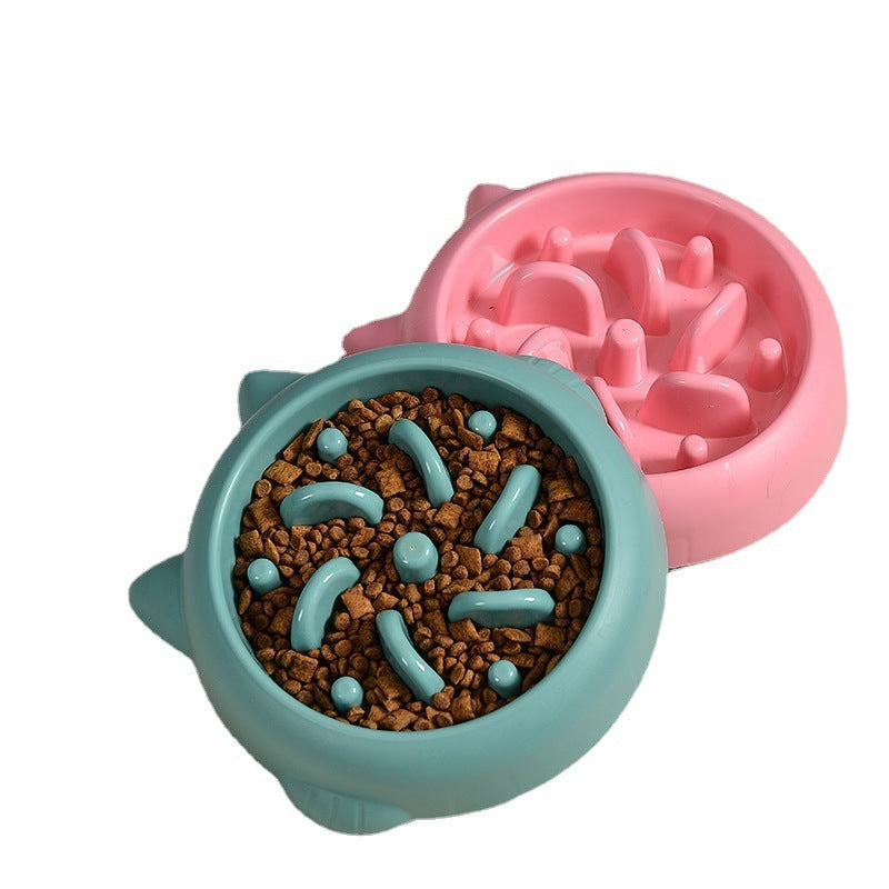 Blue and pink slow feeder dog bowls with maze design, blue bowl filled with dry kibble