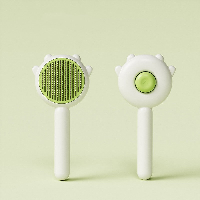 Green and white pet grooming brush with handle, shown front and back, for cat and dog hair removal