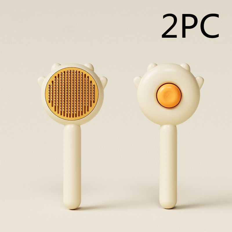 Two beige and orange pet grooming brushes with soft bristles, shown front and back on neutral background