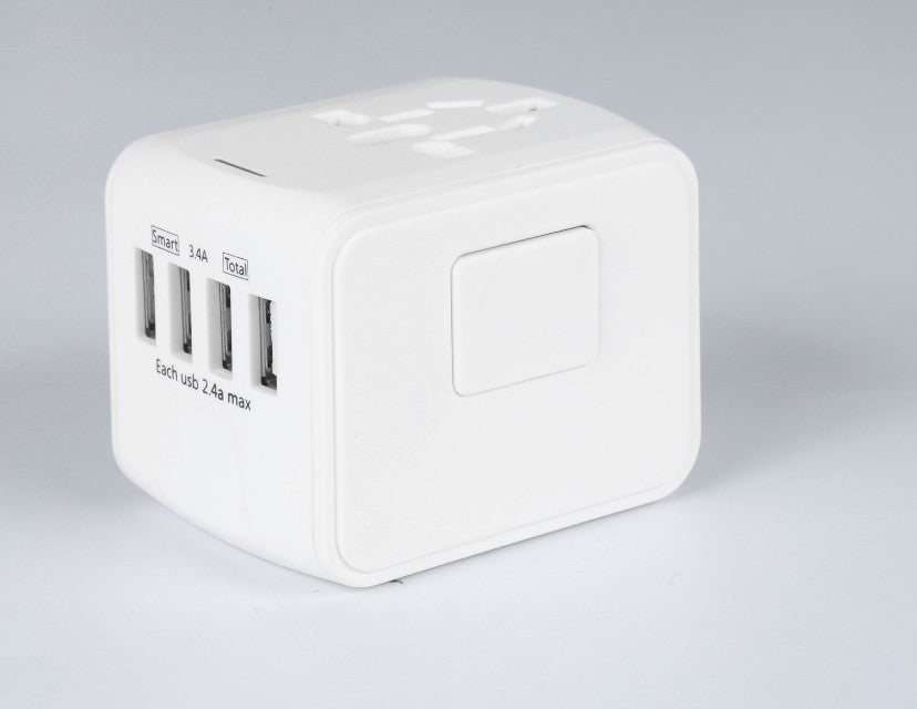White universal travel adapter with four USB charging ports and global plug sockets