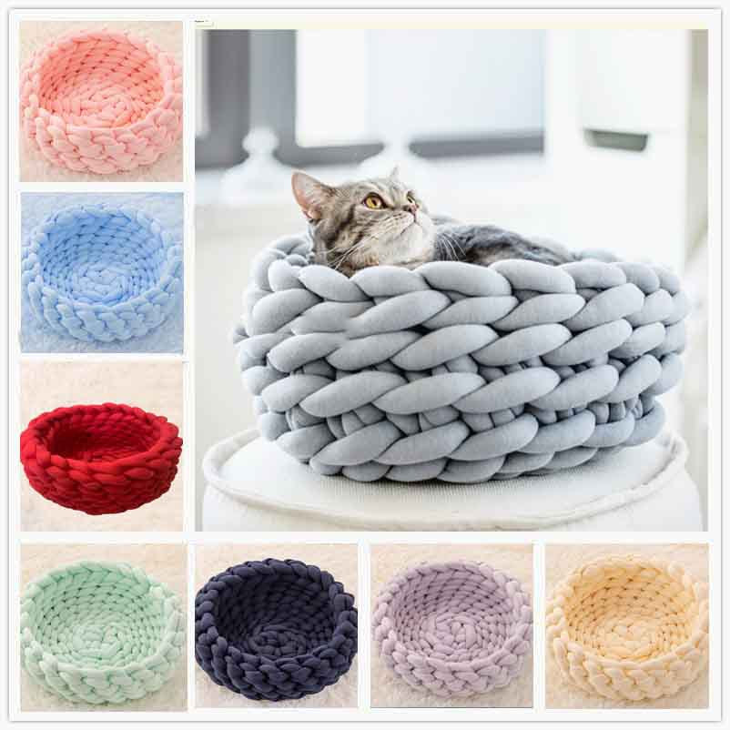 Grey chunky knit plush round cat bed with a tabby cat inside and seven colorful bed options