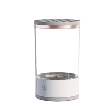 grey and white USB rechargeable electric makeup brush cleaner with cylindrical design and power button